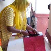 Woman Artisan Cutting Pattern of Skirt